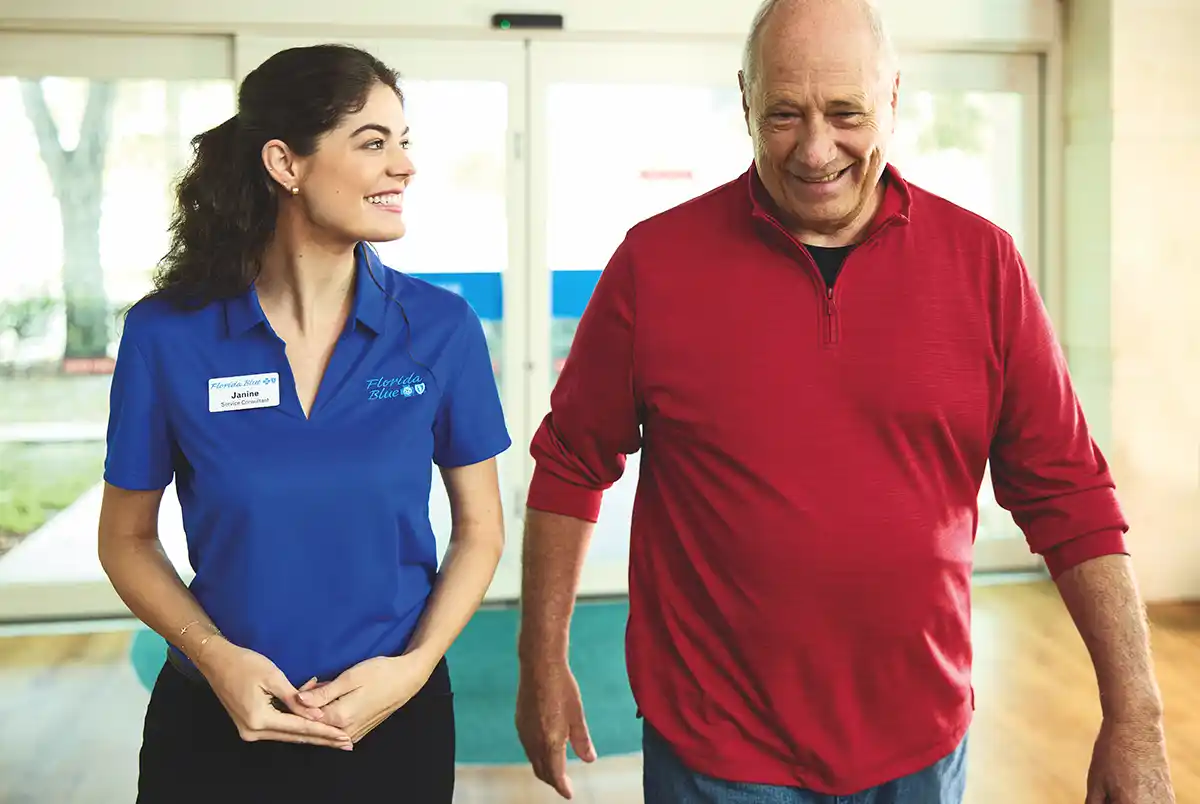 florida blue member walking and talking with a dedicated agent