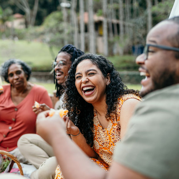 Family eating and laughing outside