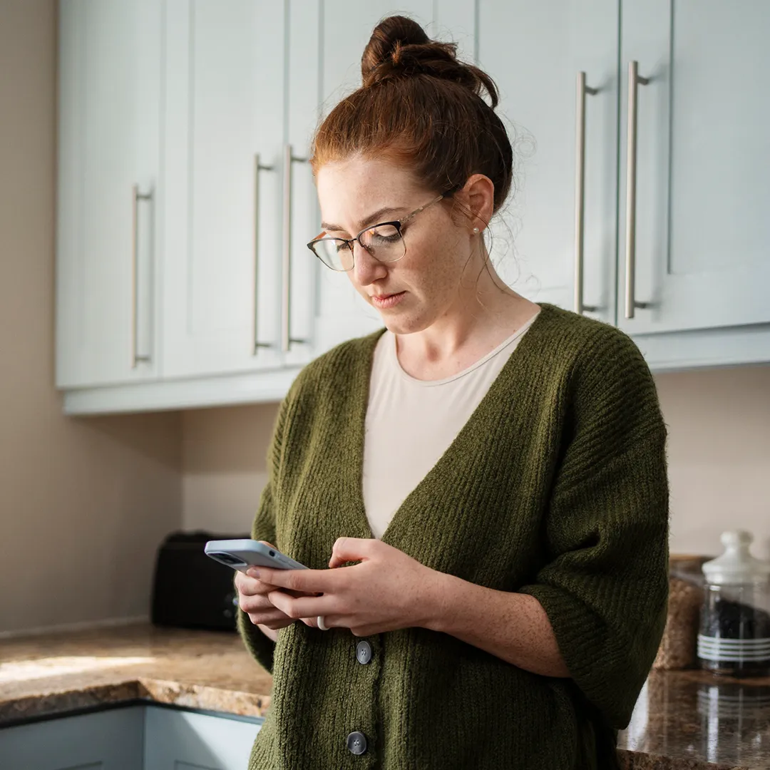 woman shopping for a Florida Blue health plan on her mobile phone