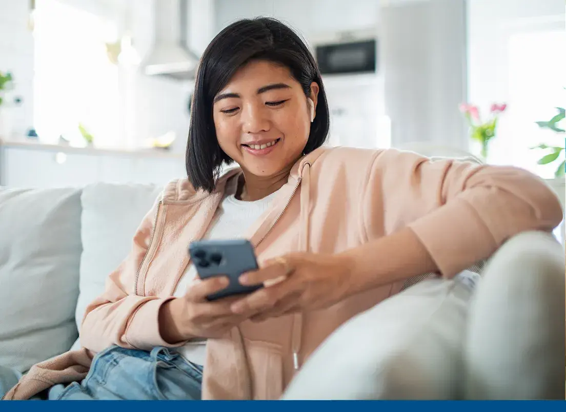 young woman researching Florida Blue health plans on her mobile phone
