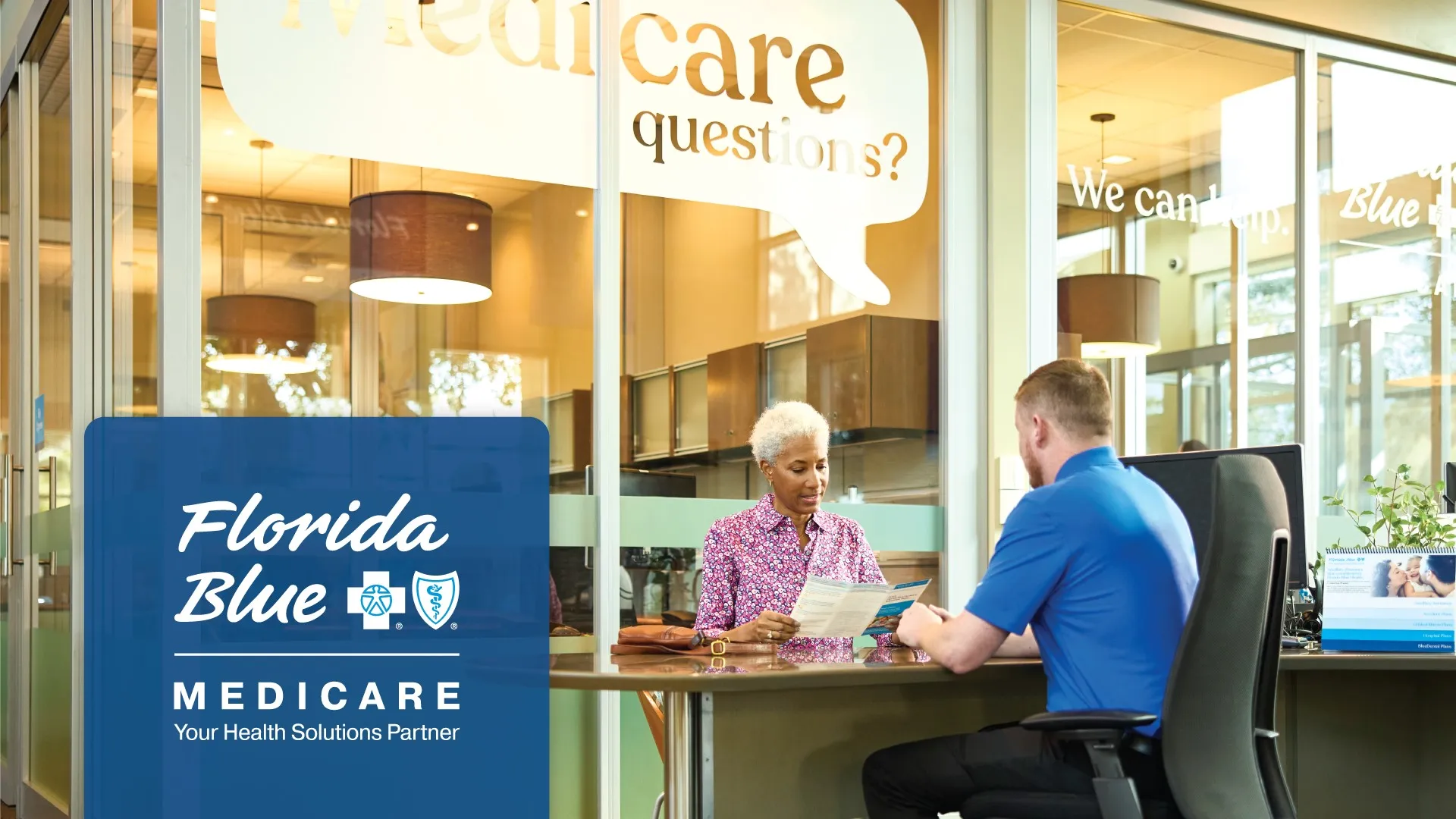 older woman discussing medicare plans with a Florida Blue center agent