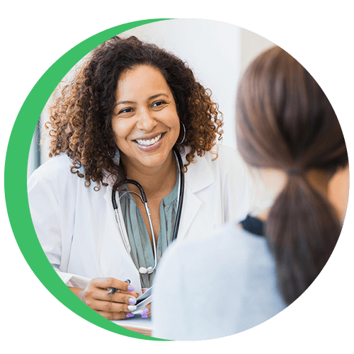 female doctor chatting with pregnant patient