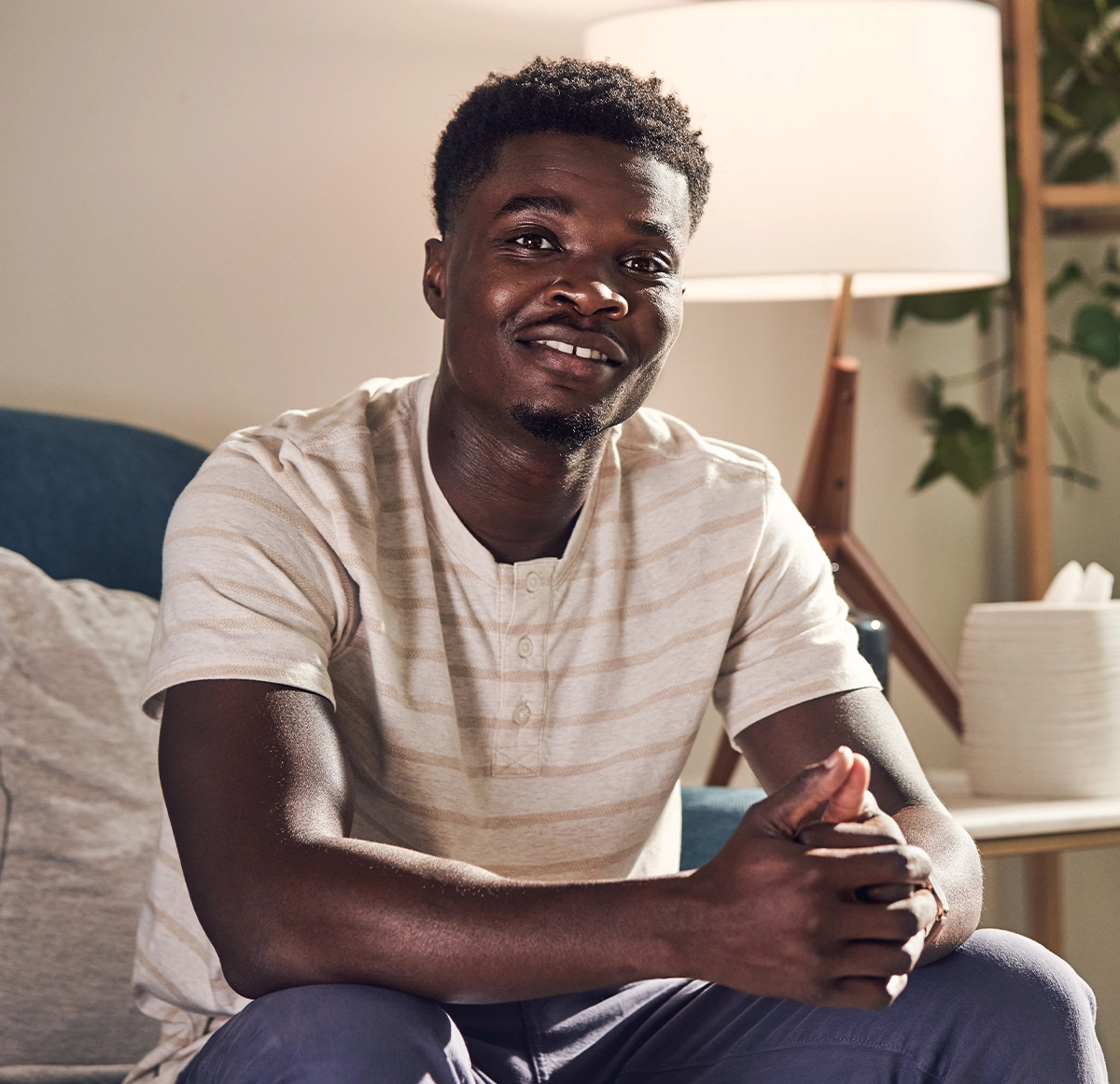 man sitting on on couch considering switching to a Florida Blue health plan