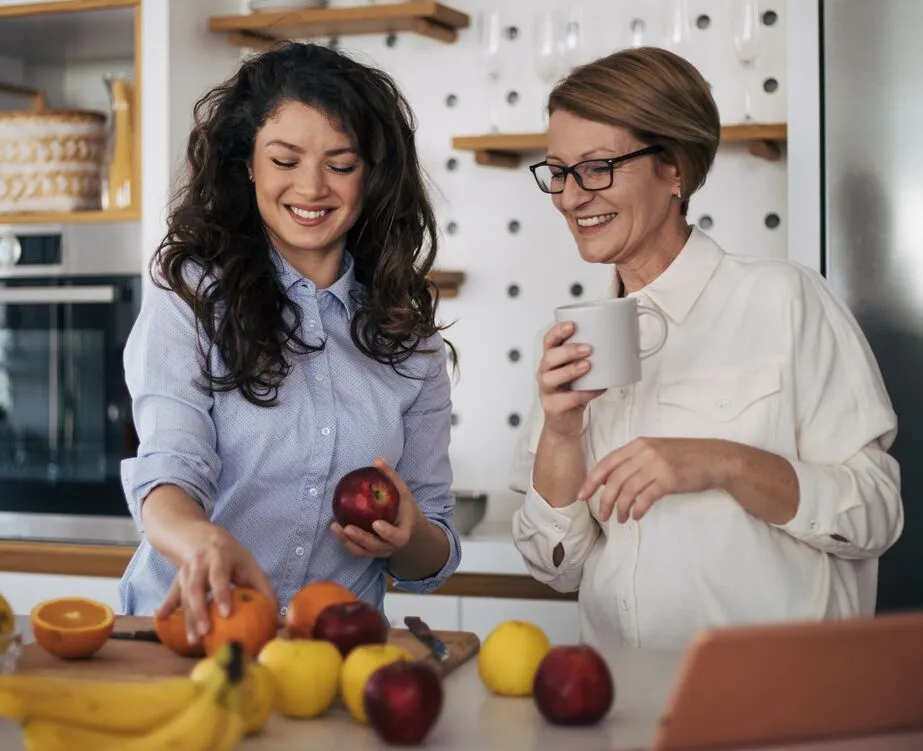 mother and daughter preparing produce for healthy meal