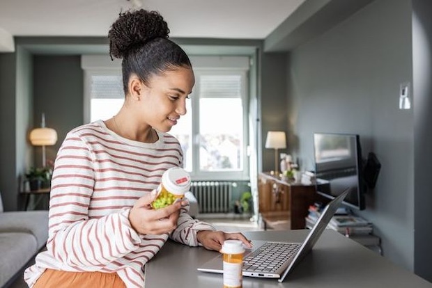 woman comparing medication costs online