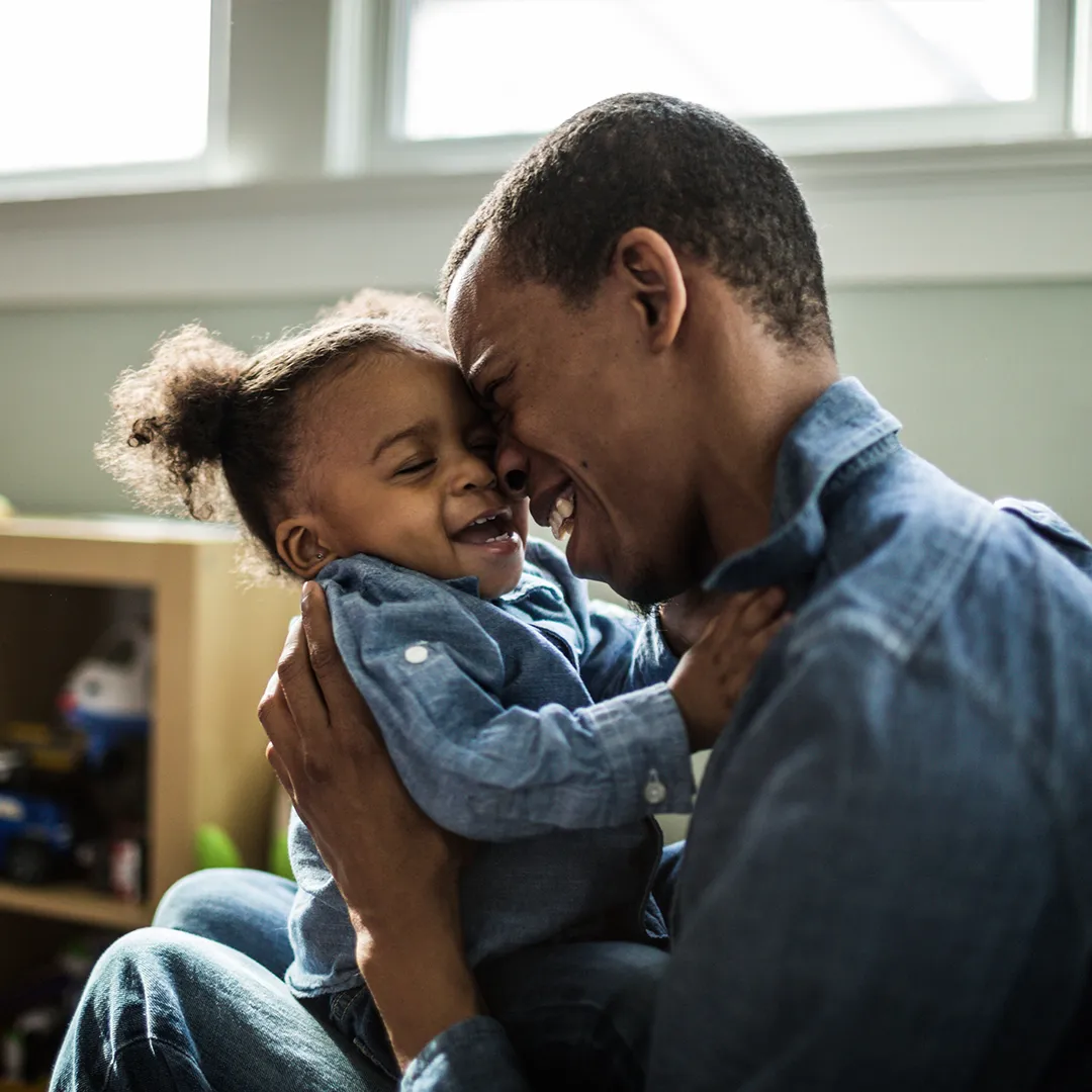 father and daughter shopping for a health plan online via their tablet