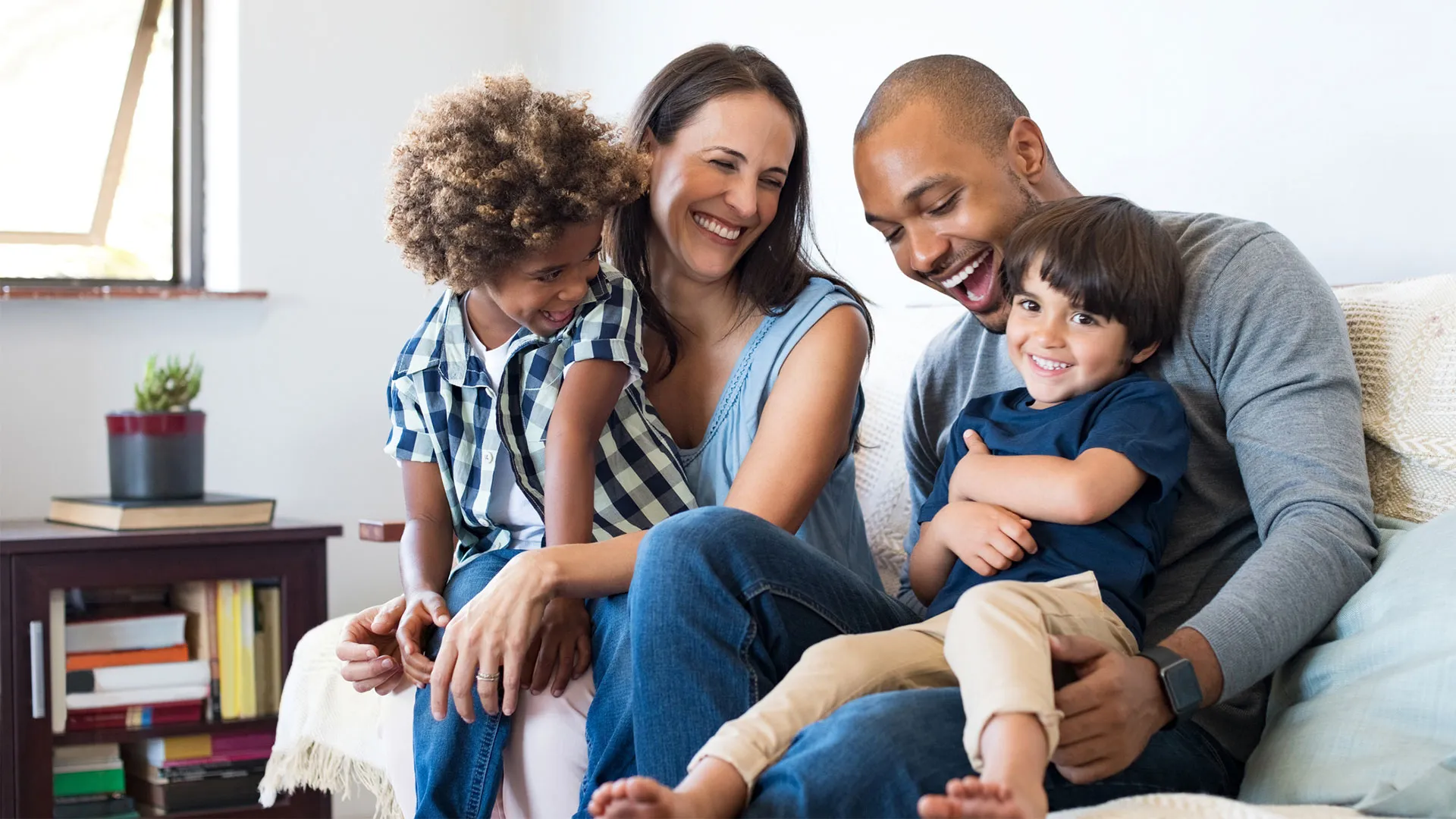 family sitting on couch