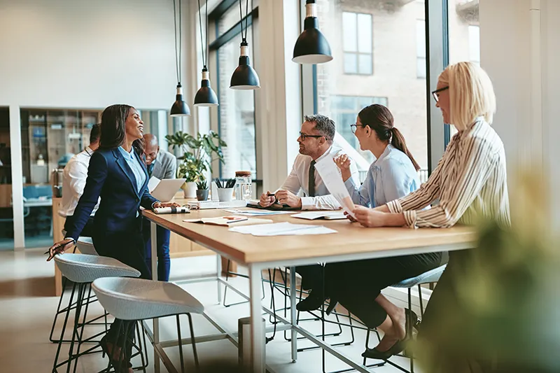 small business employees working together at a high-top table