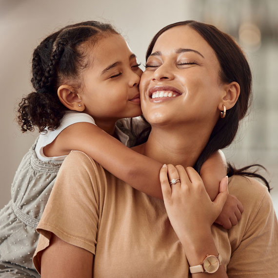 Mom and daughter embracing