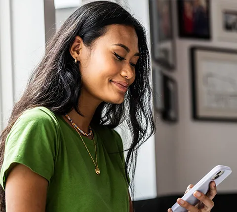 woman looking at Florida Blue plan options on her phone