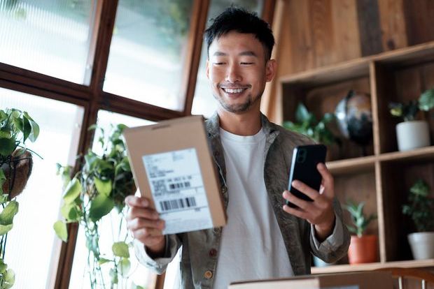 man receiving Amazon home delivery pharmacy package