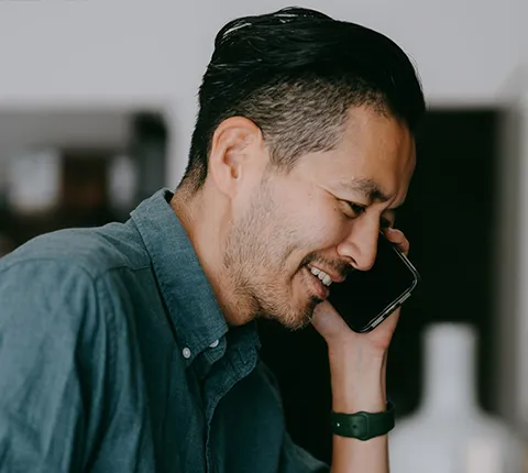 man talking on the phone with a Florida Blue agent