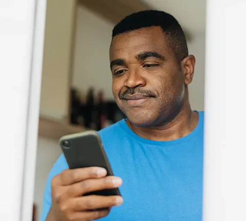 man looking at test results with his wife and doctor