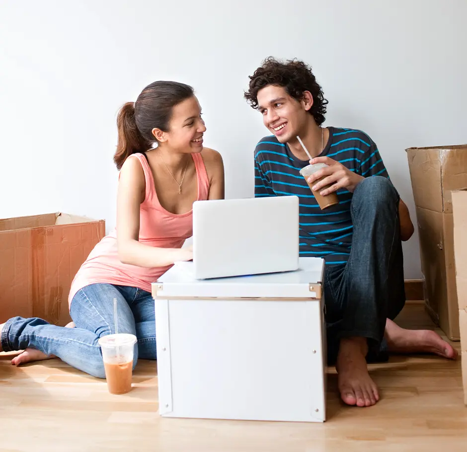 new Florida residents unpacking boxes and drinking coffee
