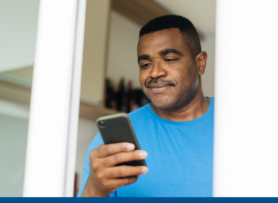 man looking for a Florida Blue health plan on his phone