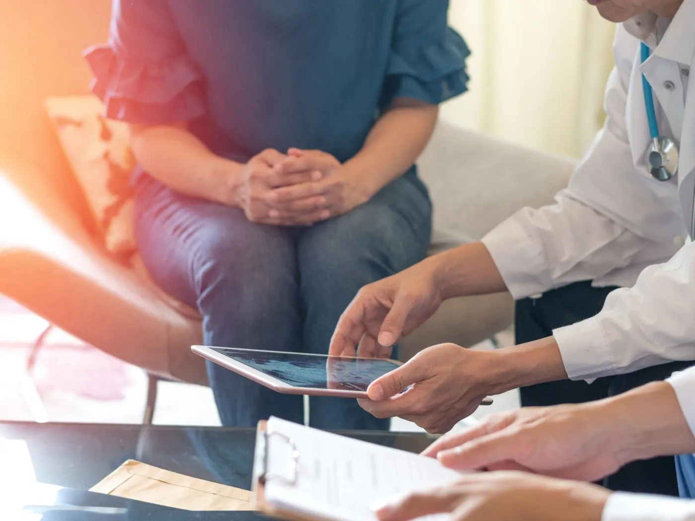 doctor and patient looking at iPad